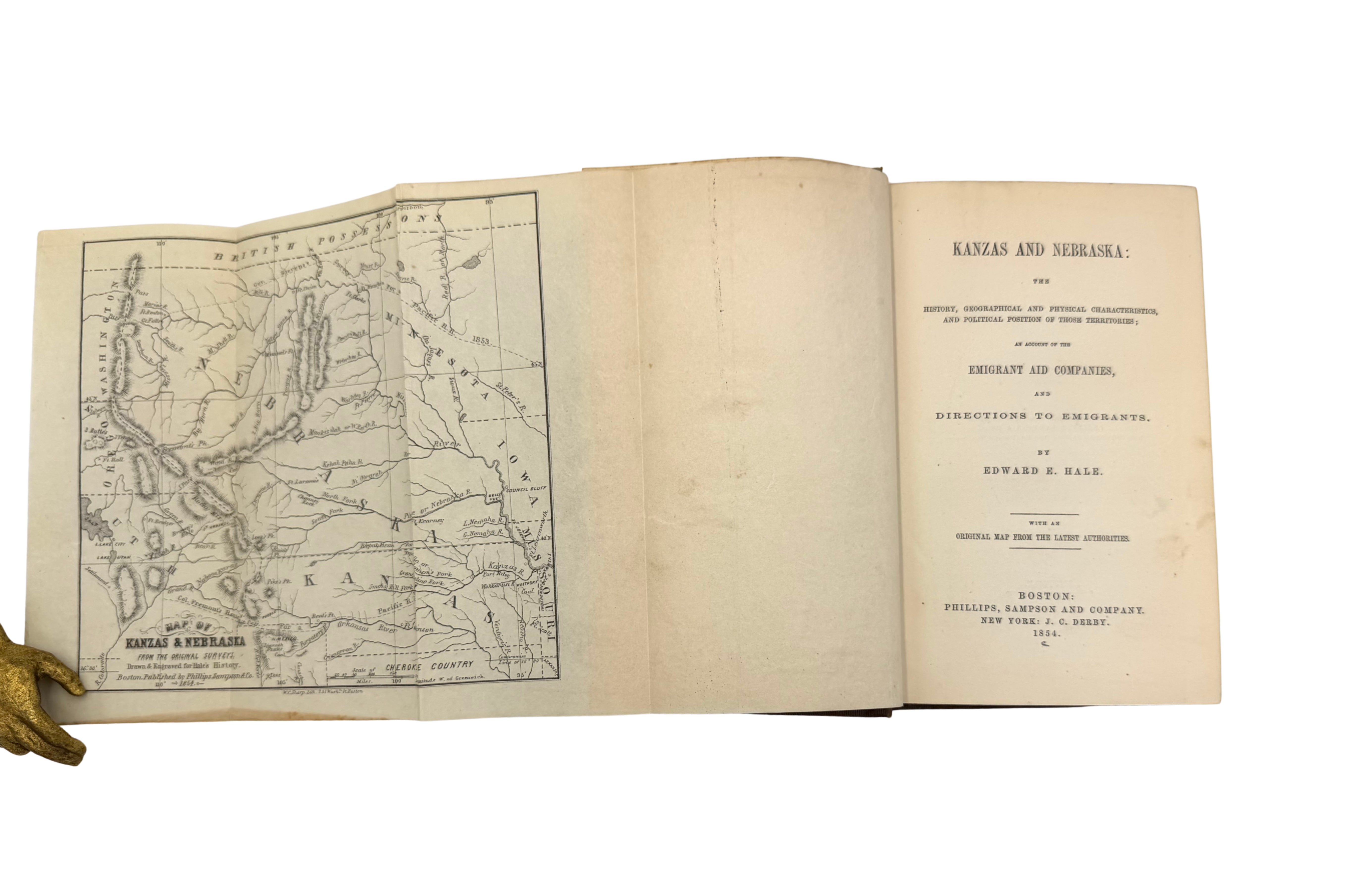 Open book with a map on the left page and text on the right, on a white background