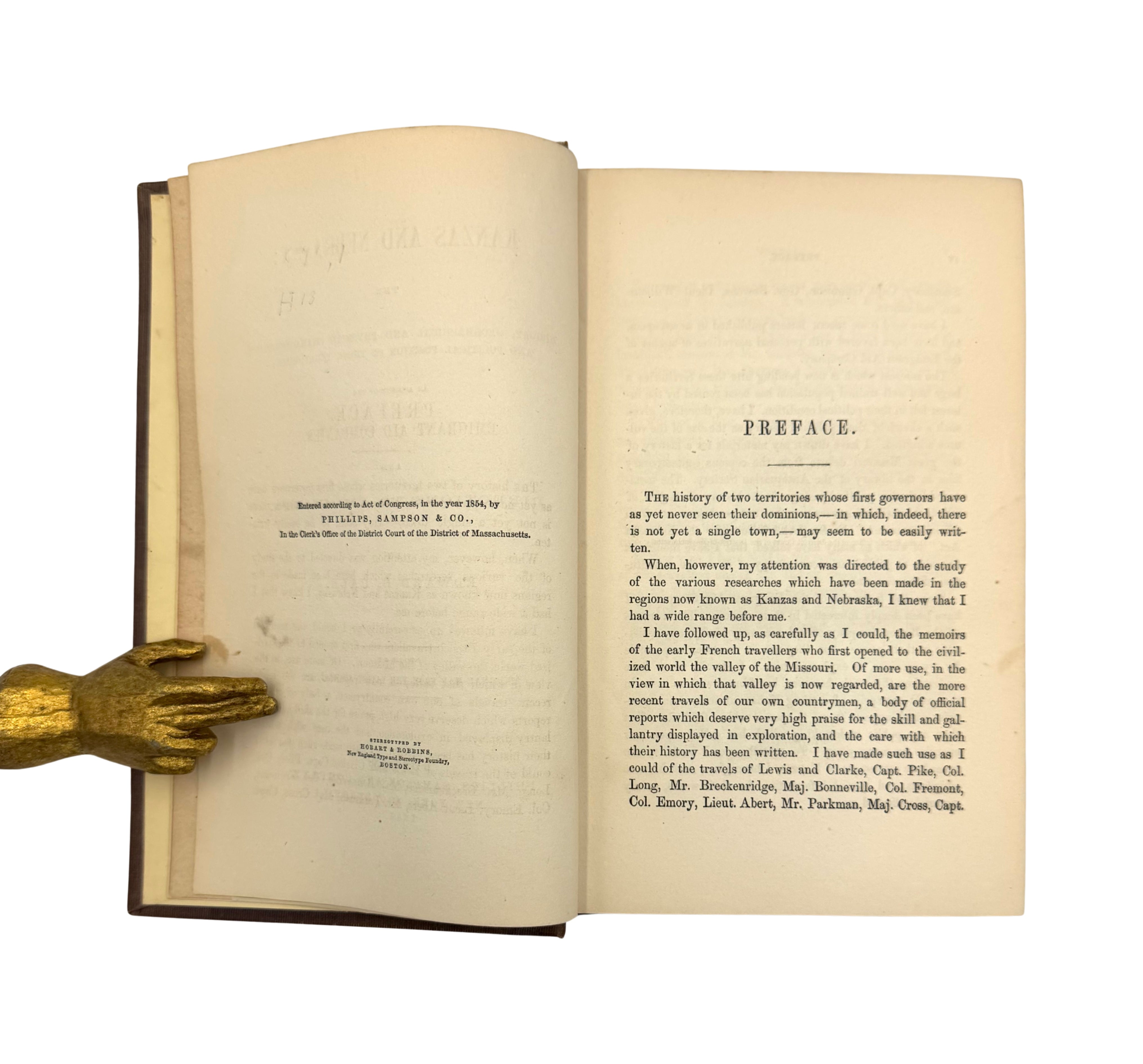 Book open to the the copyright page and preface, on a white background